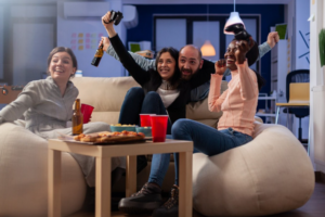 Group of friends laughing and enjoying a game night together as part of an entertainment leisure mindful life 